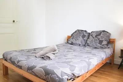 Un ou plusieurs lits dans un hébergement de l'établissement Apartment 3P 20 minutes by subway from Paris