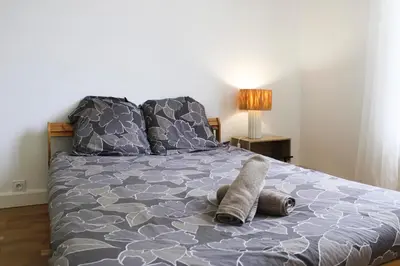 Un ou plusieurs lits dans un hébergement de l'établissement Apartment 3P 20 minutes by subway from Paris