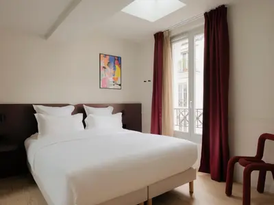 Un ou plusieurs lits dans un hébergement de l'établissement Edgar Suites - Lemercier