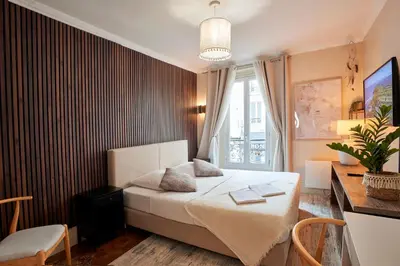 Un ou plusieurs lits dans un hébergement de l'établissement Charming Batignolles Studio