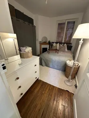 Un ou plusieurs lits dans un hébergement de l'établissement Sublime appartement cosy près de la Tour Eiffel