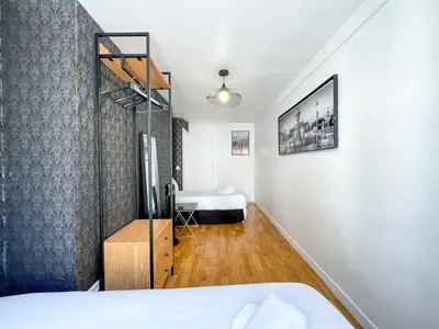 Un ou plusieurs lits dans un hébergement de l'établissement Appartement 02 - Paris Faubourg Bail Mobilité
