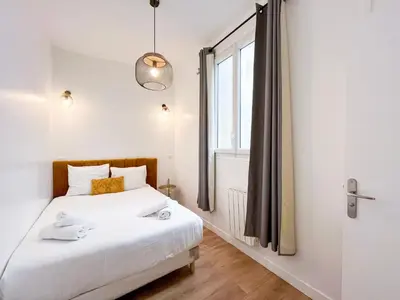 Un ou plusieurs lits dans un hébergement de l'établissement Appartement 06 - Paris Faubourg Bail Mobilité