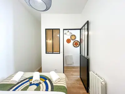 Un ou plusieurs lits dans un hébergement de l'établissement Appartement 06 - Paris Faubourg Bail Mobilité