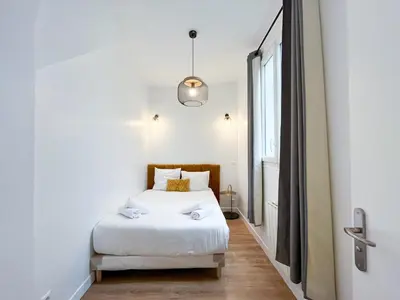 Un ou plusieurs lits dans un hébergement de l'établissement Appartement 06 - Paris Faubourg Bail Mobilité