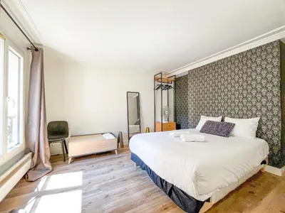 Un ou plusieurs lits dans un hébergement de l'établissement Appartement 09 - Paris Faubourg Bail Mobilité