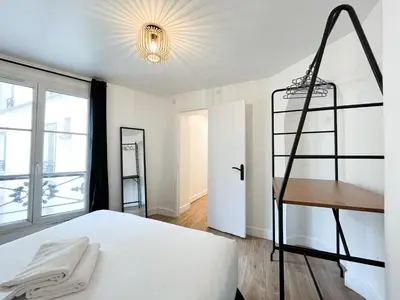 Un ou plusieurs lits dans un hébergement de l'établissement Appartement 12 - Paris Faubourg Bail Mobilité