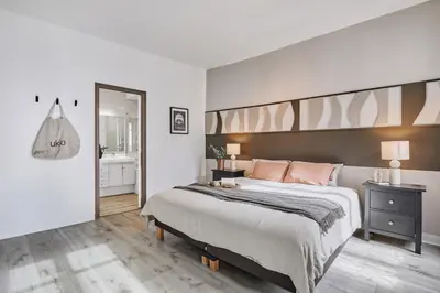 Un ou plusieurs lits dans un hébergement de l'établissement Han - 3 chambres et balcon à Trocadéro