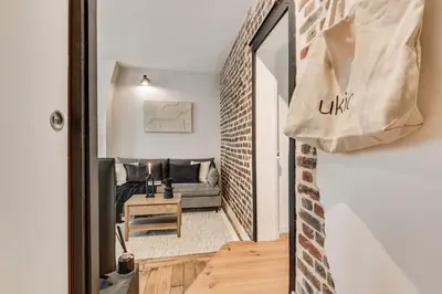 Coin salon dans l'établissement Vaux - 1 chambre a Batignolles