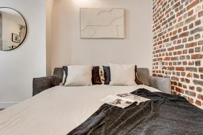 Un ou plusieurs lits dans un hébergement de l'établissement Vaux - 1 chambre a Batignolles