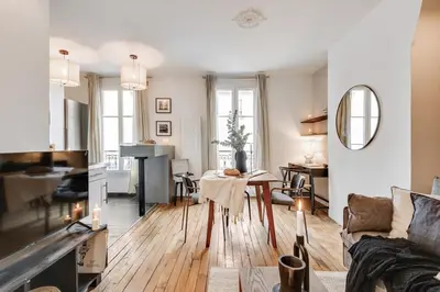 Coin salon dans l'établissement Vaux - 1 chambre a Batignolles