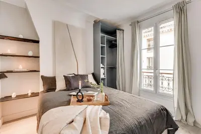 Un ou plusieurs lits dans un hébergement de l'établissement Vaux - 1 chambre a Batignolles