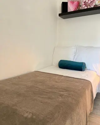 Un ou plusieurs lits dans un hébergement de l'établissement Studio Compacto Torre Eiffel -Paris