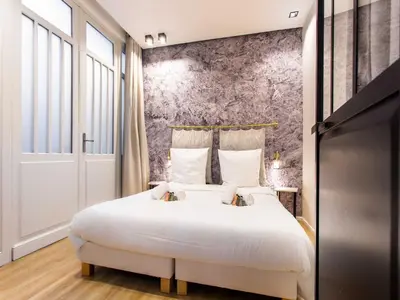 Un ou plusieurs lits dans un hébergement de l'établissement Magnificent apartment - 2BR 4P - bourse