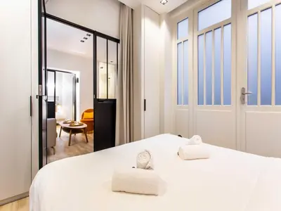 Un ou plusieurs lits dans un hébergement de l'établissement Magnificent apartment - 2BR 4P - bourse