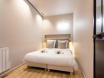 Un ou plusieurs lits dans un hébergement de l'établissement Magnificent apartment - 2BR 4P - bourse