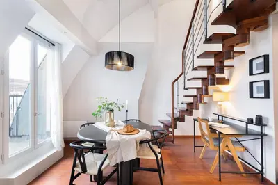 Coin salon dans l'établissement Jonquille - Duplex 2 chambres à Jardin des Plantes