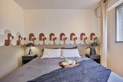 Un ou plusieurs lits dans un hébergement de l'établissement Sanoa - 3 chambres et balcon à Muette / Passy