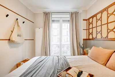 Un ou plusieurs lits dans un hébergement de l'établissement Gueta - 3 chambres à Jardin des Plantes