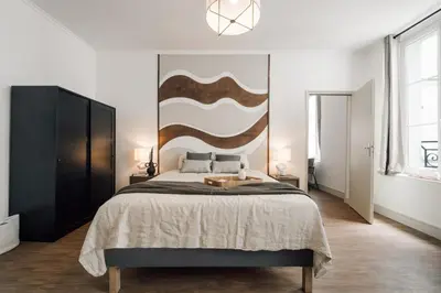 Un ou plusieurs lits dans un hébergement de l'établissement Tenam - 1 chambre à Archives (3 Arr.)