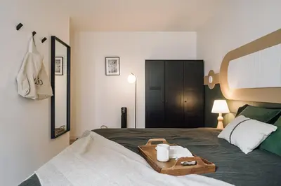 Un ou plusieurs lits dans un hébergement de l'établissement Bornova - 2 chambres et balcon à Tour Eiffel