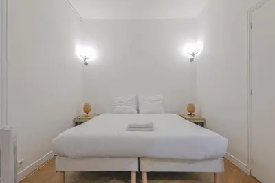 Un ou plusieurs lits dans un hébergement de l'établissement 2 Bedroom Apartment-8P-Madeleine With Netflix
