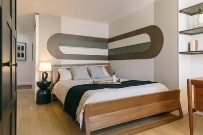 Un ou plusieurs lits dans un hébergement de l'établissement Ukayil - 3 chambres à Louvre (1Arr.)