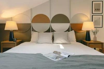 Un ou plusieurs lits dans un hébergement de l'établissement Ukayil - 3 chambres à Louvre (1Arr.)
