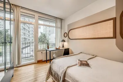 Un ou plusieurs lits dans un hébergement de l'établissement Cicek - 3 chambres et balcon à Beaugrenelle