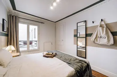 Un ou plusieurs lits dans un hébergement de l'établissement Sabah - 2 chambres à Paradis / Petites Écuries