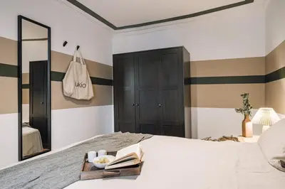 Un ou plusieurs lits dans un hébergement de l'établissement Sabah - 2 chambres à Paradis / Petites Écuries