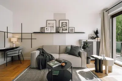 Coin salon dans l'établissement Neel - 3 chambres et balcon à Neuilly-Sur-Seine