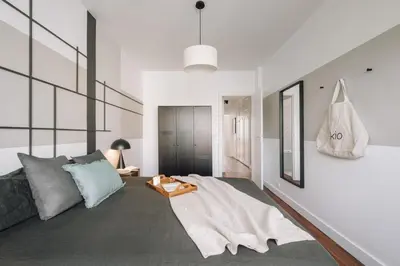 Un ou plusieurs lits dans un hébergement de l'établissement Neel - 3 chambres et balcon à Neuilly-Sur-Seine