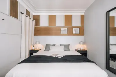 Un ou plusieurs lits dans un hébergement de l'établissement Rivoli - 2 chambres et balcon à Louvre / Tuileries