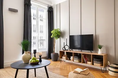 Télévision ou salle de divertissement dans l'établissement Taillon - 2 chambres à Trocadéro