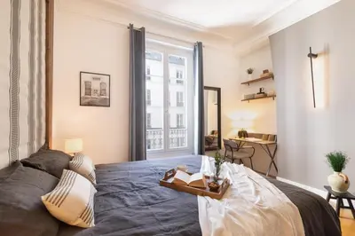 Un ou plusieurs lits dans un hébergement de l'établissement Taillon - 2 chambres à Trocadéro