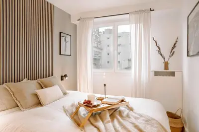 Un ou plusieurs lits dans un hébergement de l'établissement Marcos - 2 chambres et balcon à Batignolles