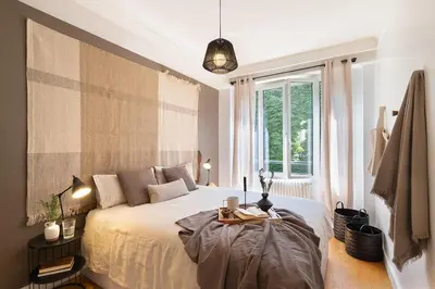 Un ou plusieurs lits dans un hébergement de l'établissement Arnave - 3 chambres et balcon à Auteuil