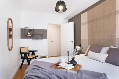 Un ou plusieurs lits dans un hébergement de l'établissement Arnave - 3 chambres et balcon à Auteuil