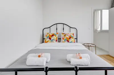 Un ou plusieurs lits dans un hébergement de l'établissement Suite Massena - Opulence au cœur de Paris