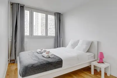 Un ou plusieurs lits dans un hébergement de l'établissement Suite Massena - Opulence au cœur de Paris