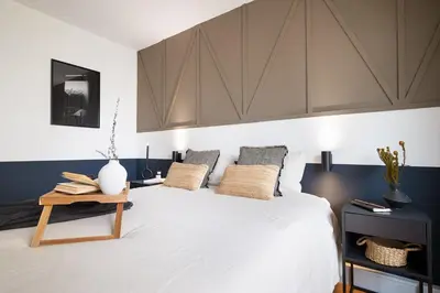 Un ou plusieurs lits dans un hébergement de l'établissement Angles - 1 chambre à Montmartre