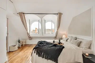 Un ou plusieurs lits dans un hébergement de l'établissement Castro - 1 chambre à Champs de Mars