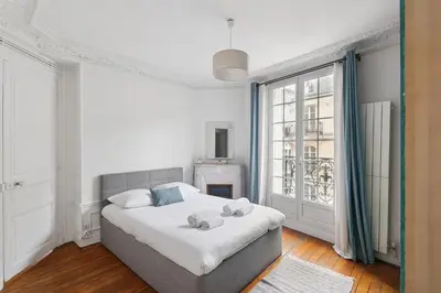Un ou plusieurs lits dans un hébergement de l'établissement Haussmannian and Central - Montmartre and Sacré-Coeur