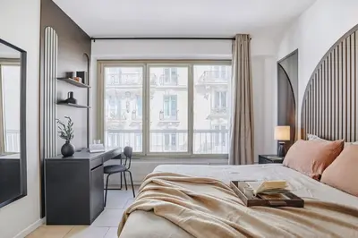 Un ou plusieurs lits dans un hébergement de l'établissement Sahil - 2 chambres à Trocadéro