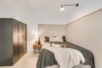 Un ou plusieurs lits dans un hébergement de l'établissement Dauphine - 1 chambre à Auteuil