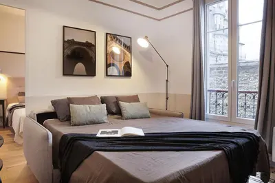 Un ou plusieurs lits dans un hébergement de l'établissement Ternes - 1 chambre à Ternes