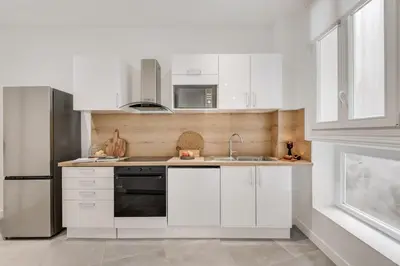 Cuisine ou kitchenette dans l'établissement Seine - 3 chambres à Hôtel de Ville
