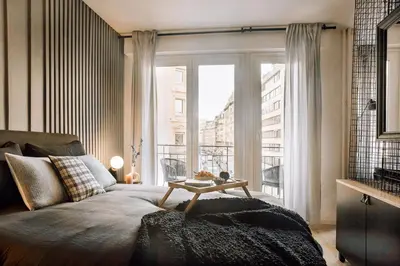 Coin salon dans l'établissement Nuria - Studio et balcon à Auteuil