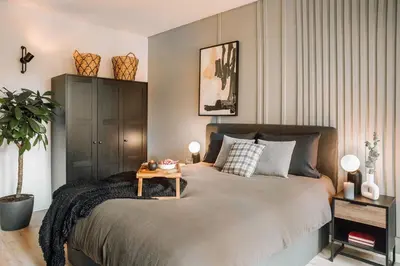 Un ou plusieurs lits dans un hébergement de l'établissement Nuria - Studio et balcon à Auteuil